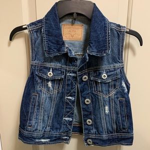 Distressed denim vest